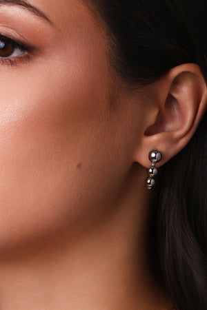 Brinco Palito Curvado Bolas Lisas Ródio Branco